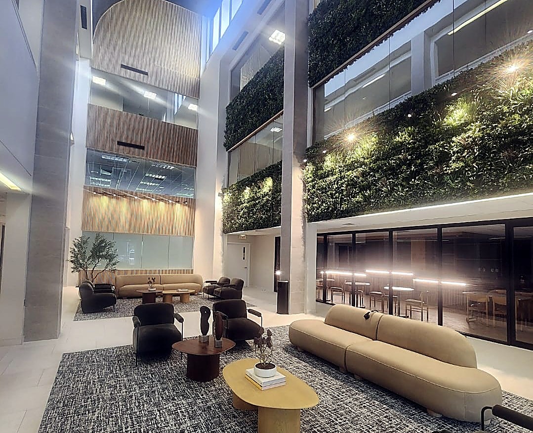 Commercial office atrium lobby with green wall