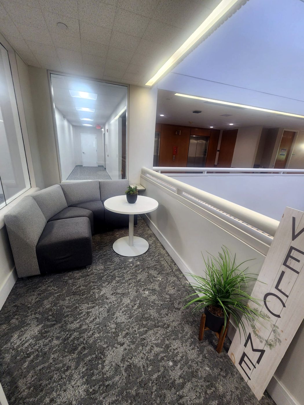 Finished office lounge area near elevators