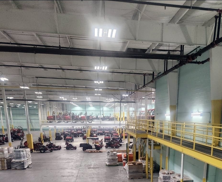 Large warehouse with mezzanine, equipment and high bay lighting
